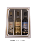 Geschenkbox mit drei Rosche Spirituosenflaschen: Haselünner Korn, Uralter und Original Moorwasser
