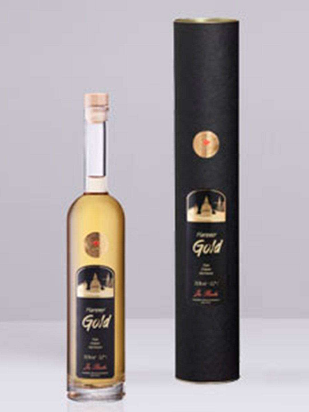 Flasche und Geschenkverpackung von Purever Gold Likör mit schwarzem Etikett und goldenem Design