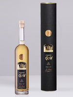 Flasche und schwarzes Geschenkrohr mit goldenem Etikett von Meppener Gold Likör